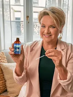 Nu Nerve Woman holding one bottle and dropper